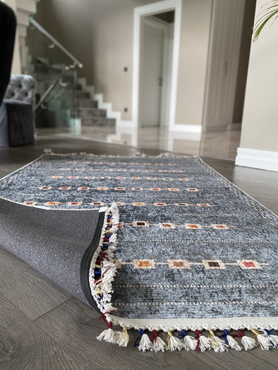 This vibrant digital printed rug features a bold pattern with pops of color, finished off with colorful fringes or braided fringes