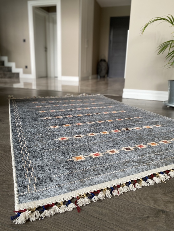 This vibrant digital printed rug features a bold pattern with pops of color, finished off with colorful fringes or braided fringes