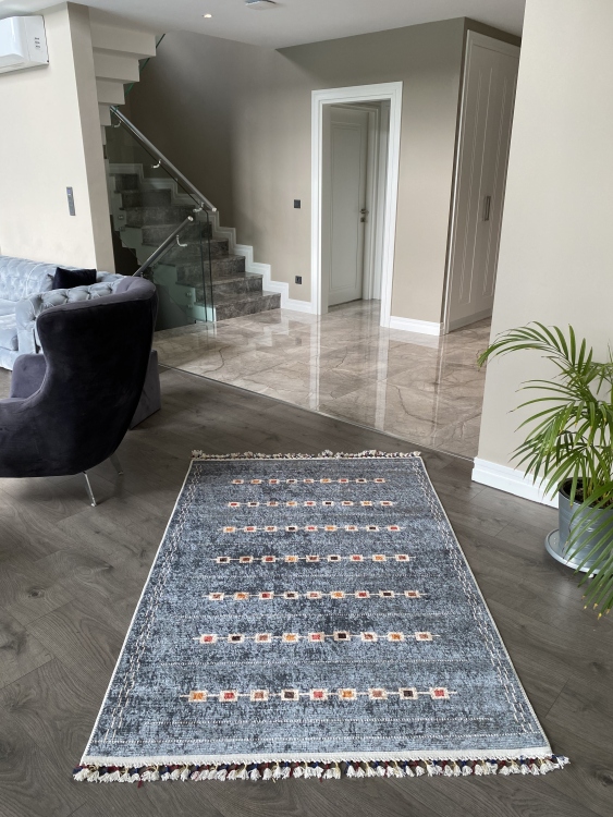 This vibrant digital printed rug features a bold pattern with pops of color, finished off with colorful fringes or braided fringes