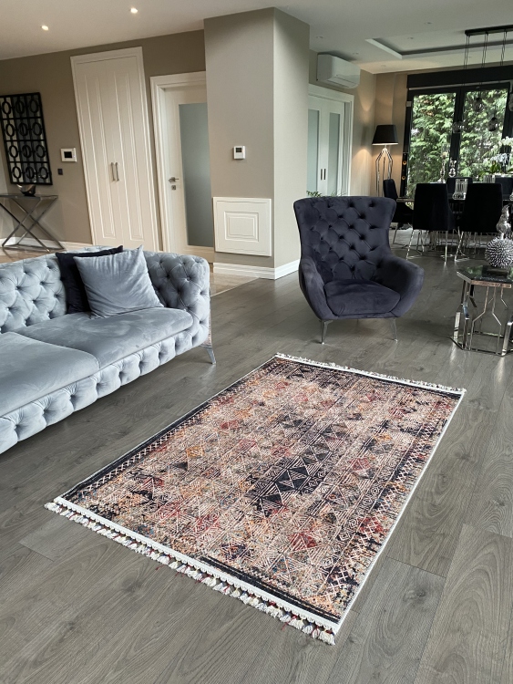 This vibrant digital printed rug features a bold pattern with pops of color, finished off with colorful fringes or braided fringes