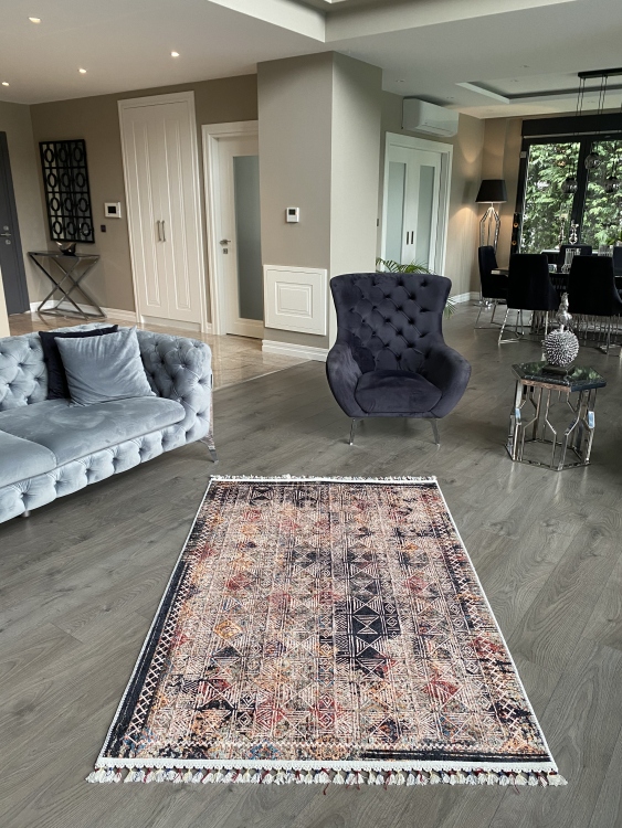 This vibrant digital printed rug features a bold pattern with pops of color, finished off with colorful fringes or braided fringes