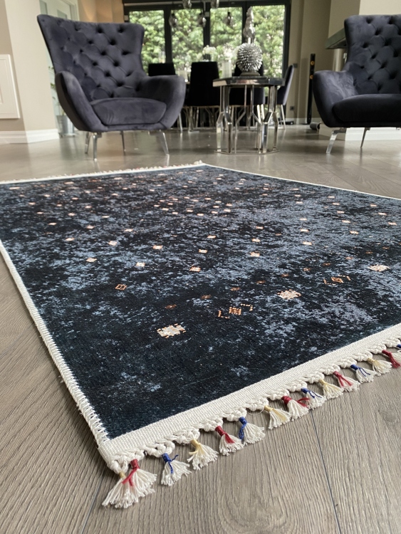 This vibrant digital printed rug features a bold pattern with pops of color, finished off with colorful fringes or braided fringes