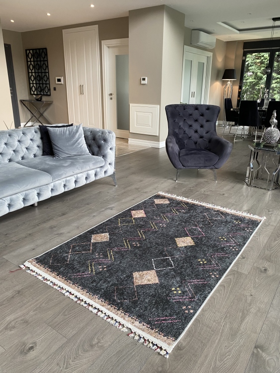 This vibrant digital printed rug features a bold pattern with pops of color, finished off with colorful fringes or braided fringes