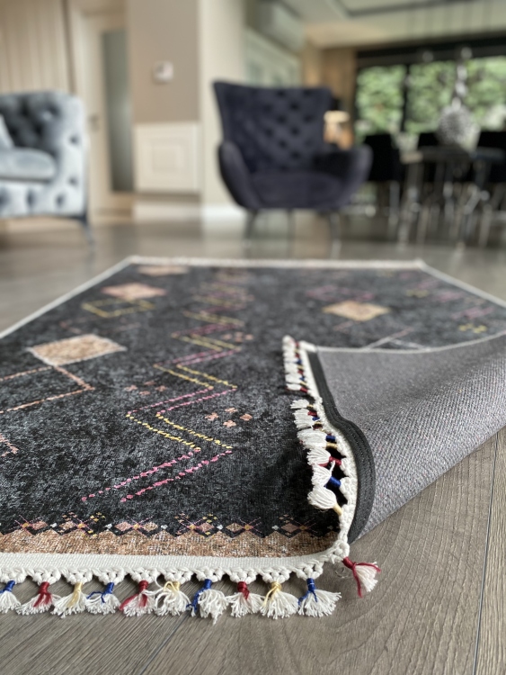 This vibrant digital printed rug features a bold pattern with pops of color, finished off with colorful fringes or braided fringes