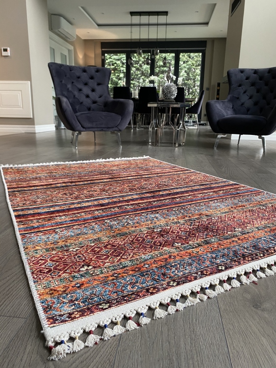 This vibrant digital printed rug features a bold pattern with pops of color, finished off with colorful fringes or braided fringes