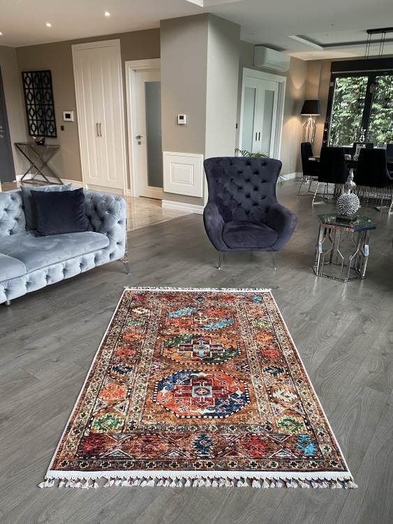 This vibrant digital printed rug features a bold pattern with pops of color, finished off with colorful fringes or braided fringes