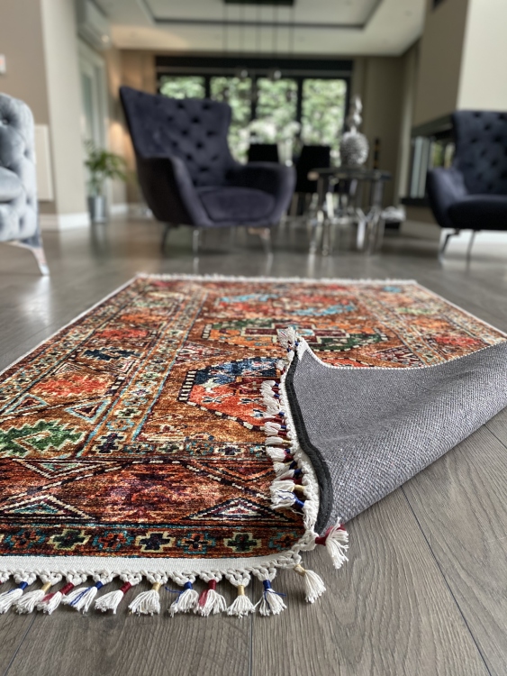 This vibrant digital printed rug features a bold pattern with pops of color, finished off with colorful fringes or braided fringes