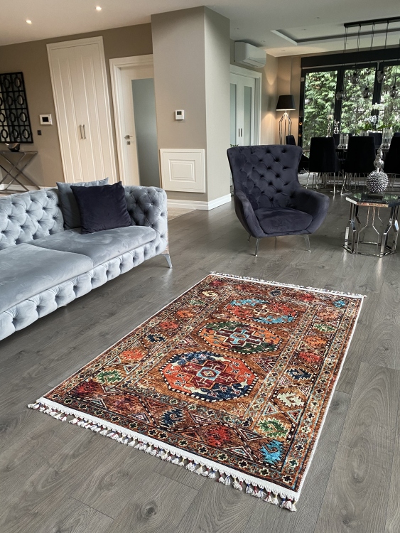 This vibrant digital printed rug features a bold pattern with pops of color, finished off with colorful fringes or braided fringes