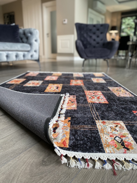 This vibrant digital printed rug features a bold pattern with pops of color, finished off with colorful fringes or braided fringes