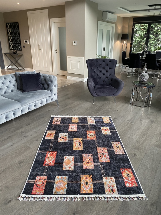 This vibrant digital printed rug features a bold pattern with pops of color, finished off with colorful fringes or braided fringes