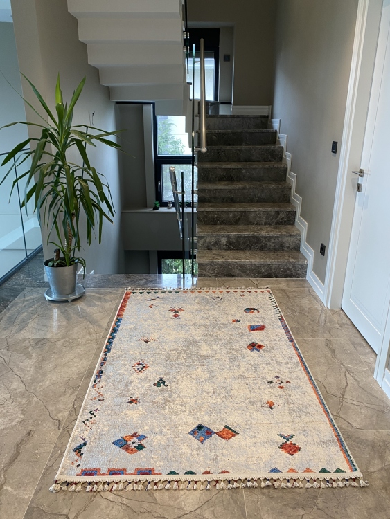 This vibrant digital printed rug features a bold pattern with pops of color, finished off with colorful fringes or braided fringes