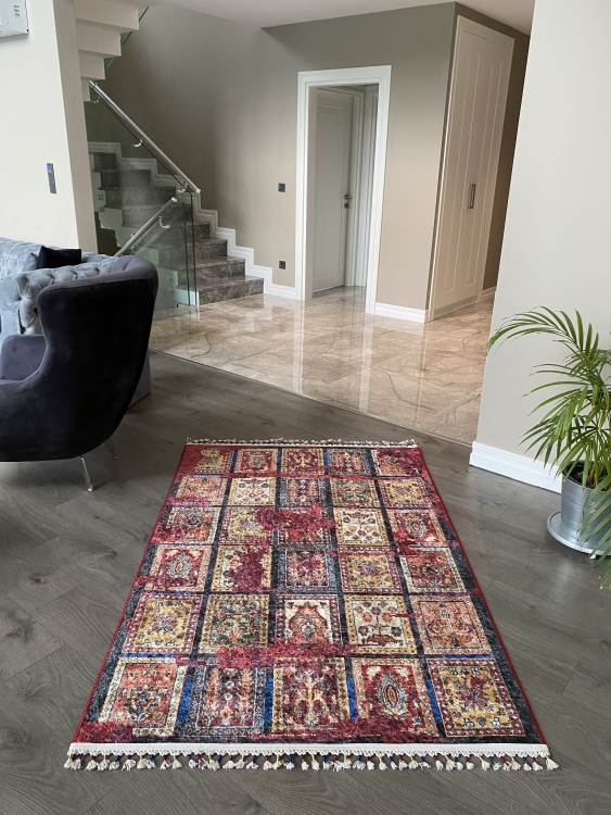 This vibrant digital printed rug features a bold pattern with pops of color, finished off with colorful fringes or braided fringes