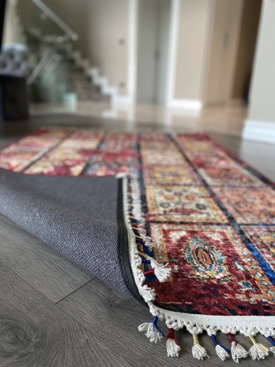 This vibrant digital printed rug features a bold pattern with pops of color, finished off with colorful fringes or braided fringes
