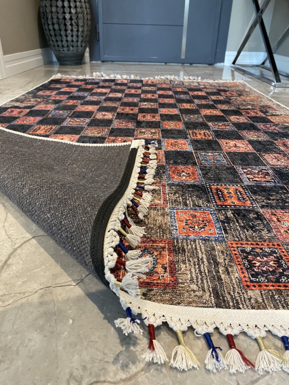 This vibrant digital printed rug features a bold pattern with pops of color, finished off with colorful fringes or braided fringes