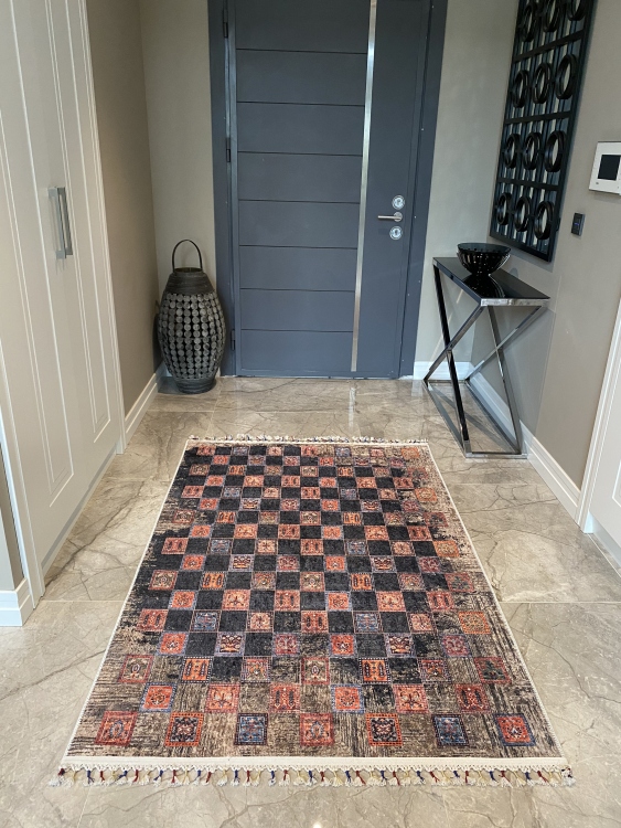 This vibrant digital printed rug features a bold pattern with pops of color, finished off with colorful fringes or braided fringes