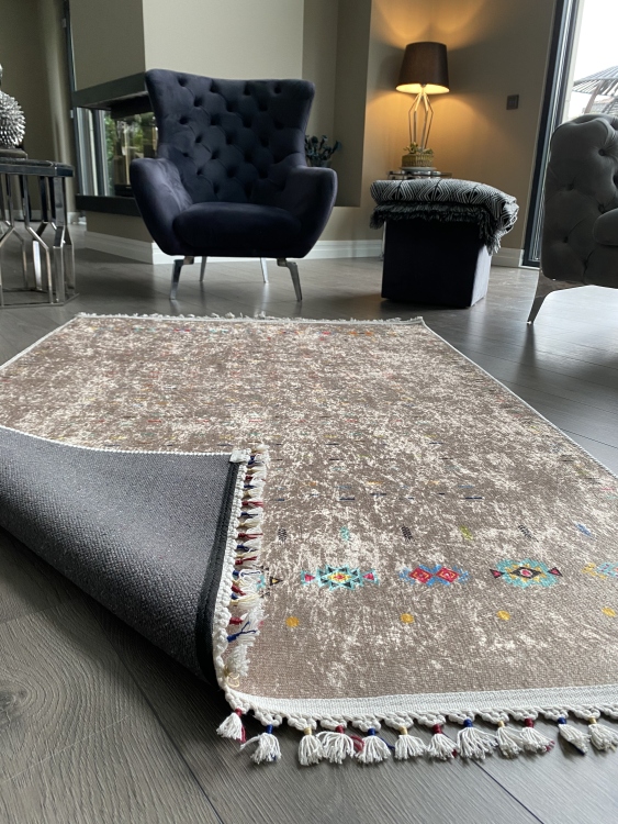 This vibrant digital printed rug features a bold pattern with pops of color, finished off with colorful fringes or braided fringes