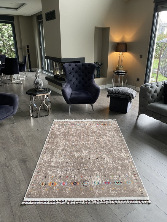 This vibrant digital printed rug features a bold pattern with pops of color, finished off with colorful fringes or braided fringes