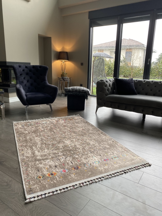 This vibrant digital printed rug features a bold pattern with pops of color, finished off with colorful fringes or braided fringes