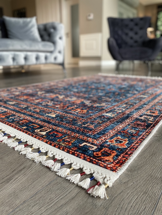 This vibrant digital printed rug features a bold pattern with pops of color, finished off with colorful fringes or braided fringes