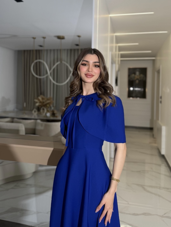 نيلي      Elegant Midi Dress with Shoulder Cape
