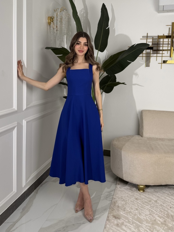 نيلي      Elegant Midi Dress with Shoulder Cape